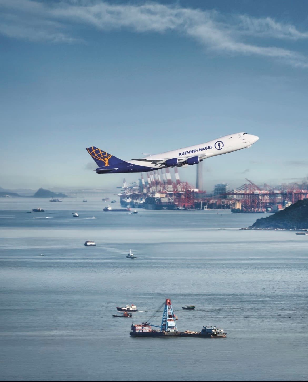 A Kuehne + Nagel cargo plane taking off from an airport runway